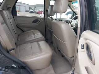 2005 Ford Escape Limited with VIN 1FMYU04155KE48512, listed as a IAAI auction lot 42196239 with 307,005 mi miles and . Bid and sale history available at DreamBid. Image 8.