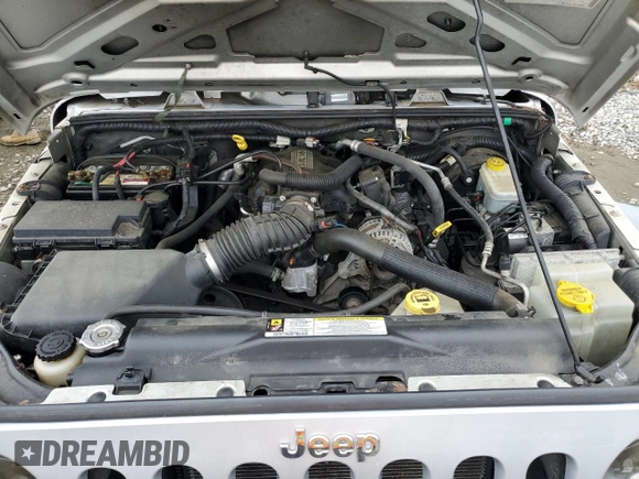 2008 Jeep Wrangler X z VIN 1J4FA24168L629174, wystawiony jako Copart lot #61199205 z przebiegiem 116 307 mil mil oraz Szkoda całkowita • Salvage title. Historia ofert i sprzedaży dostępna na DreamBid. Obrazek 11.