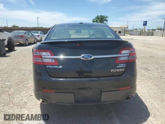 2014 Ford Taurus SEL z VIN 1FAHP2E81EG127398, wystawiony jako Copart lot #56666105 z przebiegiem 96 693 mil mil oraz Szkoda całkowita • Salvage title. Historia ofert i sprzedaży dostępna na DreamBid. Obrazek 6.