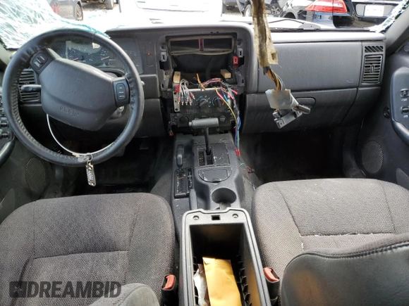 2000 Jeep Cherokee Classic с VIN 1J4FF58S7YL133399, выставлен на аукционе Copart как лот 61231845 с пробегом 196 499 миль миль и Списание • Salvage title. История ставок и продаж доступна на DreamBid. Изображение 8.