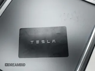 2022 Tesla Model 3 Long Range with VIN 5YJ3E1EB0NF129945, listed as a IAAI auction lot 41965531 with 59,162 mi miles and . Bid and sale history available at DreamBid. Image 11.
