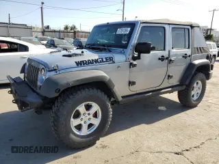 2015 Jeep Wrangler Unlimited Willys Wheeler with VIN 1C4BJWDG7FL587014, listed as a Copart auction lot 57351355 with 81,045 mi miles and Salvage Title. Bid and sale history available at DreamBid. Image 1.
