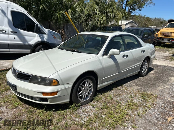 2000 Mitsubishi Diamante LS z VIN 6MMAP67P4YT001142, wystawiony jako Copart lot #49667135 z przebiegiem 243 861 mil mil oraz Tytuł czysty. Historia ofert i sprzedaży dostępna na DreamBid. Obrazek 2.