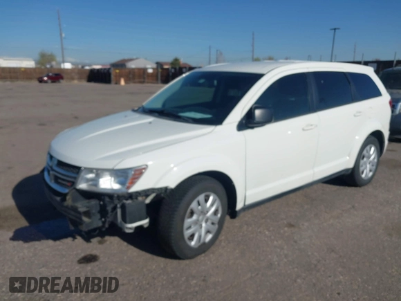 2015 Dodge Journey SE z VIN 3C4PDCAB4FT600293, wystawiony jako IAAI lot #41981386 z przebiegiem 143 573 mil mil oraz . Historia ofert i sprzedaży dostępna na DreamBid. Obrazek 2.