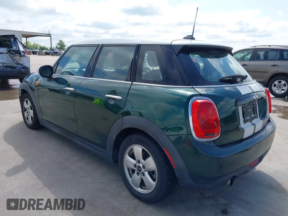 2016 MINI Hardtop 4 Door with VIN WMWXU1C52G2D10035, listed as a IAAI auction lot 42190544 with 106,383 mi miles and . Bid and sale history available at DreamBid. Image 3.