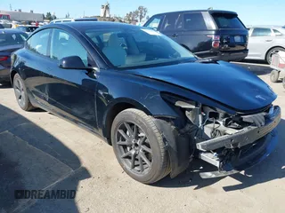 2023 Tesla Model 3 with VIN 5YJ3E1EAXPF700125, listed as a IAAI auction lot 41939839 with 14,439 mi miles and . Bid and sale history available at carsss.com. Image 1.