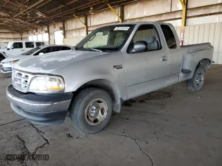 2003 Ford F-150 XL with VIN 1FTRX07233KD43811, listed as a Copart auction lot 85113414 with 215,390 mi miles and Salvage Title. Bid and sale history available at carsss.com. Image 1.