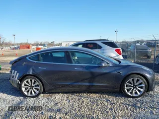 2020 Tesla Model 3 Long Range with VIN 5YJ3E1EB9LF795408, listed as a IAAI auction lot 41735428 with 56,013 mi miles. Bid and sale history available at carsss.com. Image 13.