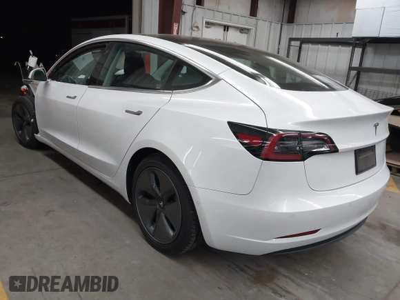 2020 Tesla Model 3 Standard Range Plus with VIN 5YJ3E1EA7LF805828, listed as a IAAI auction lot 41841505 with 44,946 mi miles and . Bid and sale history available at DreamBid. Image 3.