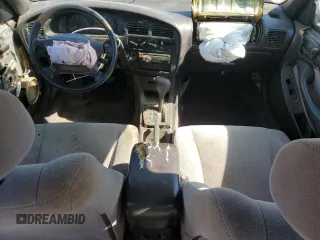 1996 Toyota Camry DX z VIN JT2BG12K7T0419839, wystawiony jako Copart lot #58267425 z przebiegiem 215 456 mil mil oraz Szkoda całkowita • Salvage title. Historia ofert i sprzedaży dostępna na DreamBid. Obrazek 8.