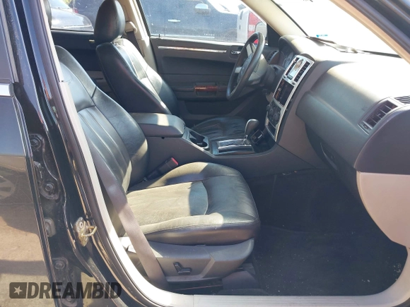 2005 Chrysler 300 with VIN 2C3JA43R65H668010, listed as a IAAI auction lot 41976405 with 216,099 mi miles. Bid and sale history available at carsss.com. Image 5.
