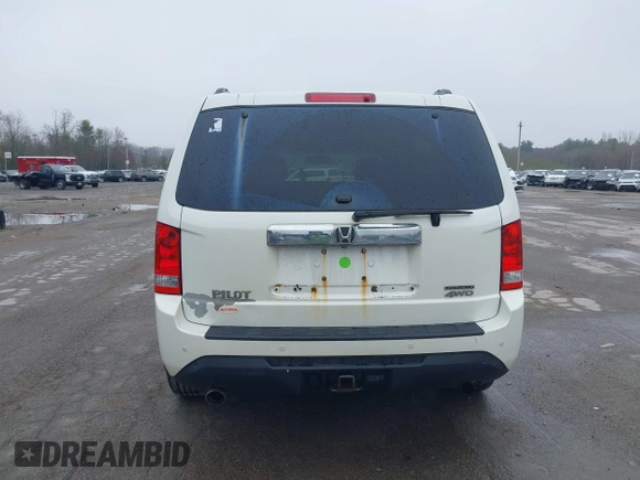 2013 Honda Pilot Touring with VIN 5FNYF4H95DB011661, listed as a IAAI auction lot 42101104 with 298,004 mi miles and . Bid and sale history available at carsss.com. Image 16.