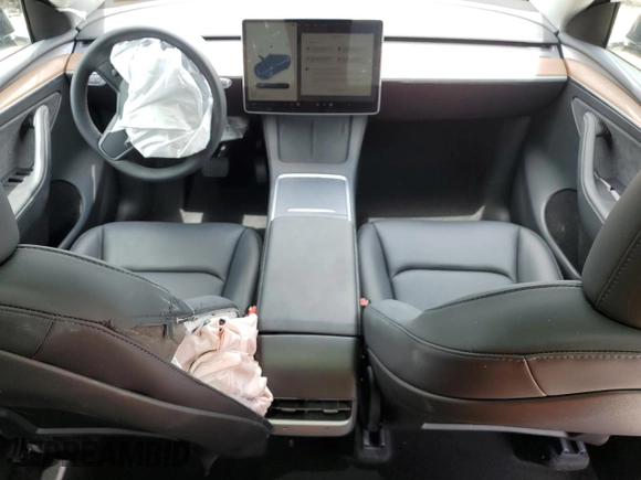 2024 Tesla Model Y with VIN 7SAYGDED2RF040079, listed as a Copart auction lot 57237054 with 2,549 mi miles and Non Repairable. Bid and sale history available at DreamBid. Image 8.