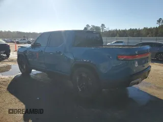 2022 Rivian R1T Launch Edition z VIN 7FCTGAAL7NN000539, wystawiony jako Copart lot #87811245 z przebiegiem Nie podano mil oraz Szkody całkowita. Historia ofert i sprzedaży dostępna na DreamBid. Obrazek 2.
