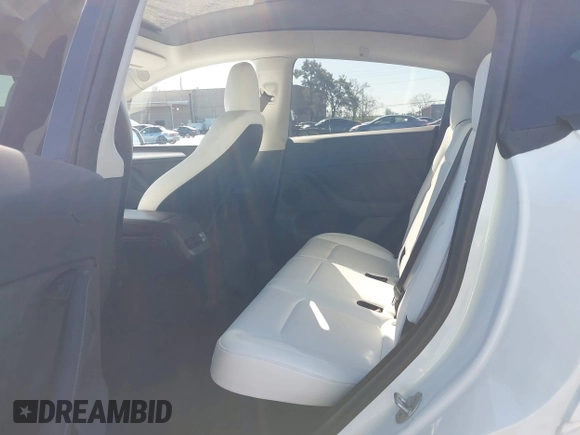 2023 Tesla Model Y Long Range with VIN 7SAYGDEE0PF945202, listed as a IAAI auction lot 41611762 with 7,316 mi miles and . Bid and sale history available at DreamBid. Image 8.