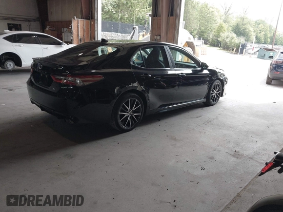 2021 Toyota Camry SE Nightshade with VIN 4T1G11AK6MU580771, listed as a IAAI auction lot 40042967 with 106,579 mi miles. Bid and sale history available at carsss.com. Image 4.