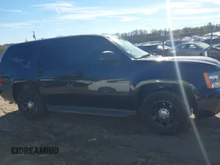 2013 Chevrolet Tahoe Commercial with VIN 1GNLC2E05DR266048, listed as a IAAI auction lot 40848505 with 95,459 mi miles and . Bid and sale history available at DreamBid. Image 13.