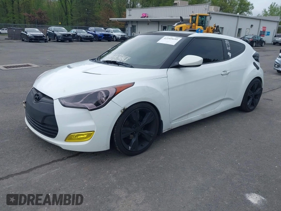 2012 Hyundai Veloster w/Gray Int with VIN KMHTC6AD6CU021176, listed as a IAAI auction lot 42205695 with 93,665 mi miles and . Bid and sale history available at DreamBid. Image 2.