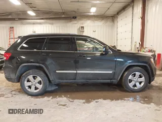 2012 Jeep Grand Cherokee Laredo with VIN 1C4RJFAT1CC225479, listed as a IAAI auction lot 41709911 with 227,150 mi miles. Bid and sale history available at carsss.com. Image 13.