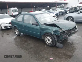 1996 Toyota Tercel DX z VIN JT2AC52L9T0127262, wystawiony jako IAAI lot #41504210 z przebiegiem 135 732 mil mil oraz . Historia ofert i sprzedaży dostępna na DreamBid. Obrazek 1.