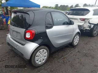 2016 Smart fortwo Passion z VIN WMEFJ5DA3GK055906, wystawiony jako IAAI lot #42274280 z przebiegiem 29 070 mil mil oraz . Historia ofert i sprzedaży dostępna na DreamBid. Obrazek 4.
