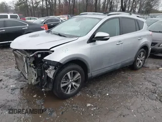2018 Toyota RAV4 XLE with VIN 2T3RFREV2JW717351, listed as a IAAI auction lot 41576522 with 147,116 mi miles. Bid and sale history available at carsss.com. Image 2.