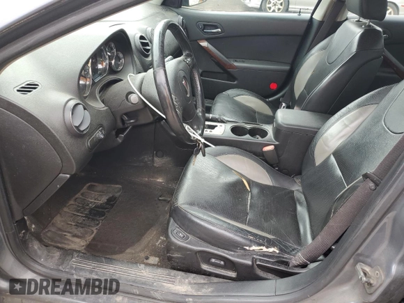 2009 Pontiac G6 GXP 1SA with VIN 1G2ZM577294217264, listed as a Copart auction lot 63824735 with 165,948 mi miles and Salvage title. Bid and sale history available at DreamBid. Image 7.