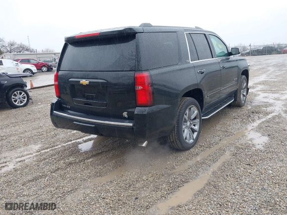 2016 Chevrolet Tahoe LTZ with VIN 1GNSKCKC2GR104305, listed as a IAAI auction lot 41697868 with 124,670 mi miles. Bid and sale history available at carsss.com. Image 4.