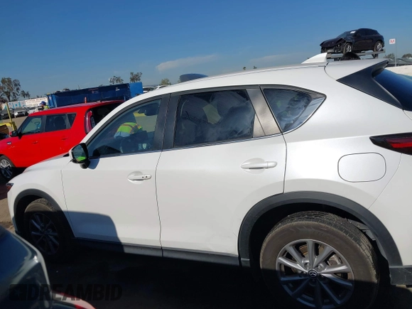 2022 Mazda CX-5 S Preferred with VIN JM3KFBCM2N0630148, listed as a IAAI auction lot 41986351 with 45,664 mi miles and . Bid and sale history available at carsss.com. Image 14.