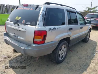 2003 Jeep Grand Cherokee Laredo with VIN 1J4GW48S83C558962, listed as a IAAI auction lot 42415803 with 312,419 mi miles and . Bid and sale history available at DreamBid. Image 4.