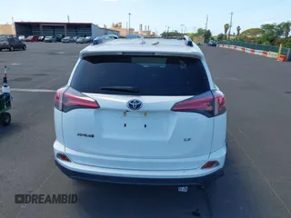 2017 Toyota RAV4 LE with VIN JTMZFREV2HJ721392, listed as a IAAI auction lot 41697170 with 59,357 mi miles and . Bid and sale history available at carsss.com. Image 16.