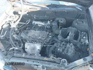 1999 Mitsubishi Mirage DE z VIN JA3AY26A0XU017889, wystawiony jako IAAI lot #40457172 z przebiegiem Nie podano mil oraz . Historia ofert i sprzedaży dostępna na DreamBid. Obrazek 11.