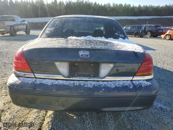 1999 Ford Crown Victoria LX with VIN 2FAFP74W9XX137078, listed as a Copart auction lot 82999554 with 166,132 mi miles and Salvage Title. Bid and sale history available at carsss.com. Image 6.