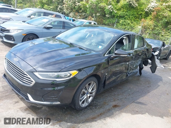 2019 Ford Fusion SEL with VIN 3FA6P0CD5KR182520, listed as a IAAI auction lot 42014190 with 107,028 mi miles and . Bid and sale history available at carsss.com. Image 18.