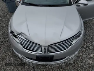 2016 Lincoln MKZ z VIN 3LN6L2JK1GR617572, wystawiony jako Copart lot #59119845 z przebiegiem 155 191 mil mil oraz Szkoda całkowita • Salvage title. Historia ofert i sprzedaży dostępna na DreamBid. Obrazek 11.