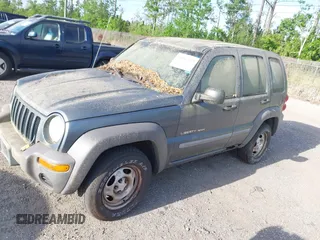 2002 Jeep Liberty Sport with VIN 1J4GL48K32W324864, listed as a IAAI auction lot 41962179 with 147,988 mi miles. Bid and sale history available at carsss.com. Image 2.