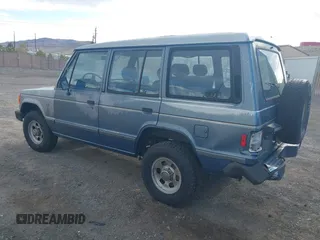 1991 Mitsubishi Montero z VIN JA4GJ31S0MJ006906, wystawiony jako IAAI lot #41782268 z przebiegiem 184 605 mil mil oraz . Historia ofert i sprzedaży dostępna na DreamBid. Obrazek 3.