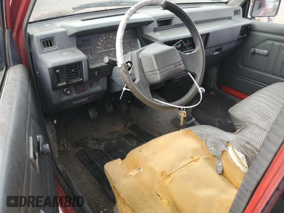 1991 Mitsubishi Mighty Max z VIN JA7FL24W2MP026041, wystawiony jako Copart lot #79159244 z przebiegiem 219 903 mil mil oraz Szkoda całkowita • Salvage title. Historia ofert i sprzedaży dostępna na DreamBid. Obrazek 8.