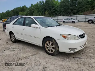 2004 Toyota Camry LE z VIN JTDBE32K440281087, wystawiony jako Copart lot #60486995 z przebiegiem 229 856 mil mil oraz Czysty tytuł • Clean title. Historia ofert i sprzedaży dostępna na DreamBid. Obrazek 4.