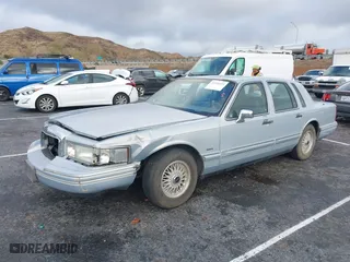 1993 Lincoln Town Car Executive with VIN 1LNLM81W6PY618899, listed as a IAAI auction lot 41566437 with 158,821 mi miles. Bid and sale history available at carsss.com. Image 2.