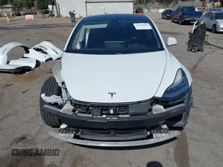 2018 Tesla Model 3 Long Range Battery with VIN 5YJ3E1EAXJF108781, listed as a IAAI auction lot 41962628 with 61,208 mi miles and . Bid and sale history available at DreamBid. Image 13.