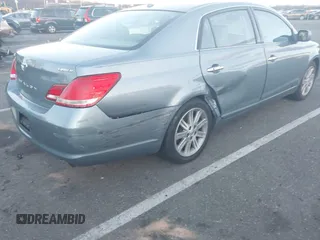 2010 Toyota Avalon XL with VIN 4T1BK3DB1AU363817, listed as a IAAI auction lot 41010053 with 259,106 mi miles and . Bid and sale history available at carsss.com. Image 12.