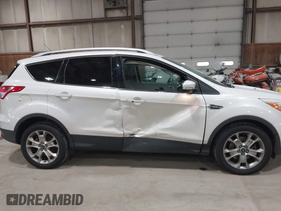 2016 Ford Escape Titanium with VIN 1FMCU9J95GUB02377, listed as a IAAI auction lot 41869557 with 88,441 mi miles. Bid and sale history available at carsss.com. Image 6.