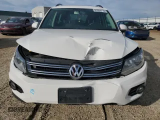 2014 Volkswagen Tiguan Trendline with VIN WVGJV3AX9EW540904, listed as a Copart auction lot 63908715 with Not provided miles and Salvage title. Bid and sale history available at DreamBid. Image 5.