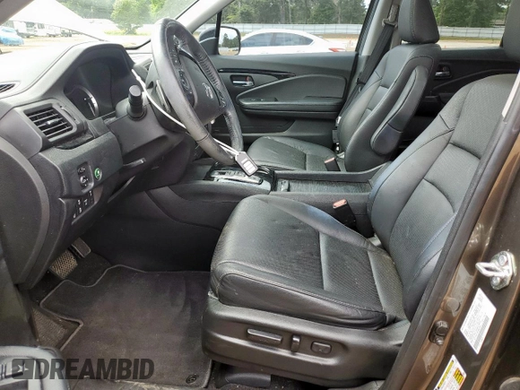 2020 Honda Ridgeline RTL-E with VIN 5FPYK3F79LB001891, listed as a Copart auction lot 58569255 with 34,513 mi miles and Salvage title. Bid and sale history available at DreamBid. Image 7.