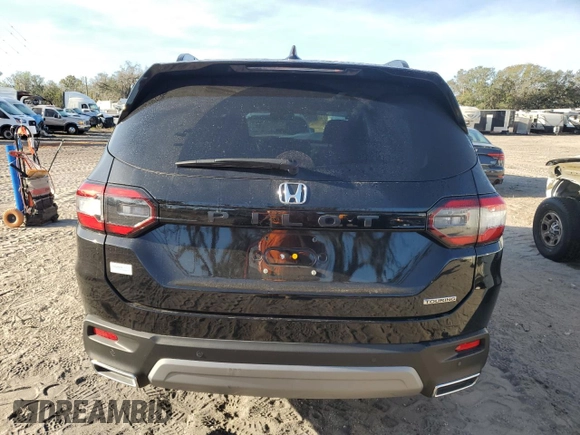 2023 Honda Pilot Touring with VIN 5FNYG2H77PB006594, listed as a Copart auction lot 83662854 with 37,637 mi miles and Salvage Title. Bid and sale history available at DreamBid. Image 6.