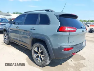 2014 Jeep Cherokee Trailhawk z VIN 1C4PJMBSXEW273520, wystawiony jako IAAI lot #42569063 z przebiegiem 137 585 mil mil oraz . Historia ofert i sprzedaży dostępna na DreamBid. Obrazek 3.