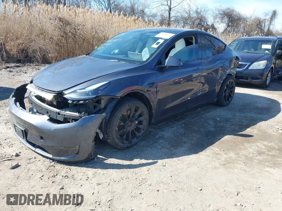 2023 Tesla Model Y Long Range with VIN 7SAYGDEE2PF883687, listed as a IAAI auction lot 41589837 with 36,890 mi miles. Bid and sale history available at carsss.com. Image 2.