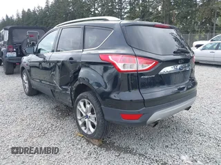 2014 Ford Escape Titanium with VIN 1FMCU9J95EUD60587, listed as a IAAI auction lot 42129854 with 155,559 mi miles and . Bid and sale history available at DreamBid. Image 3.