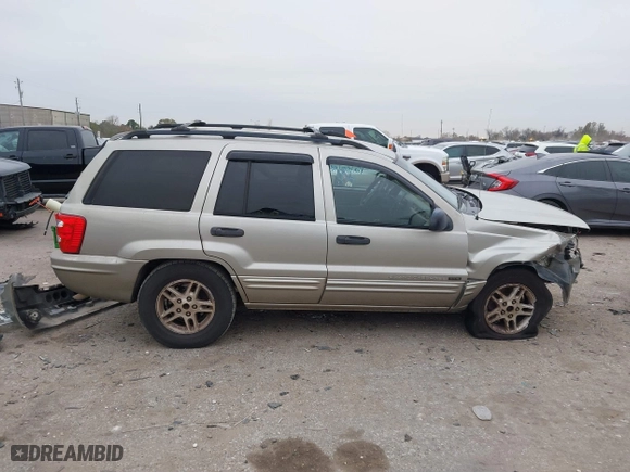 2004 Jeep Grand Cherokee Laredo with VIN 1J4GX48S44C301120, listed as a IAAI auction lot 41281556 with 267,246 mi miles. Bid and sale history available at carsss.com. Image 14.